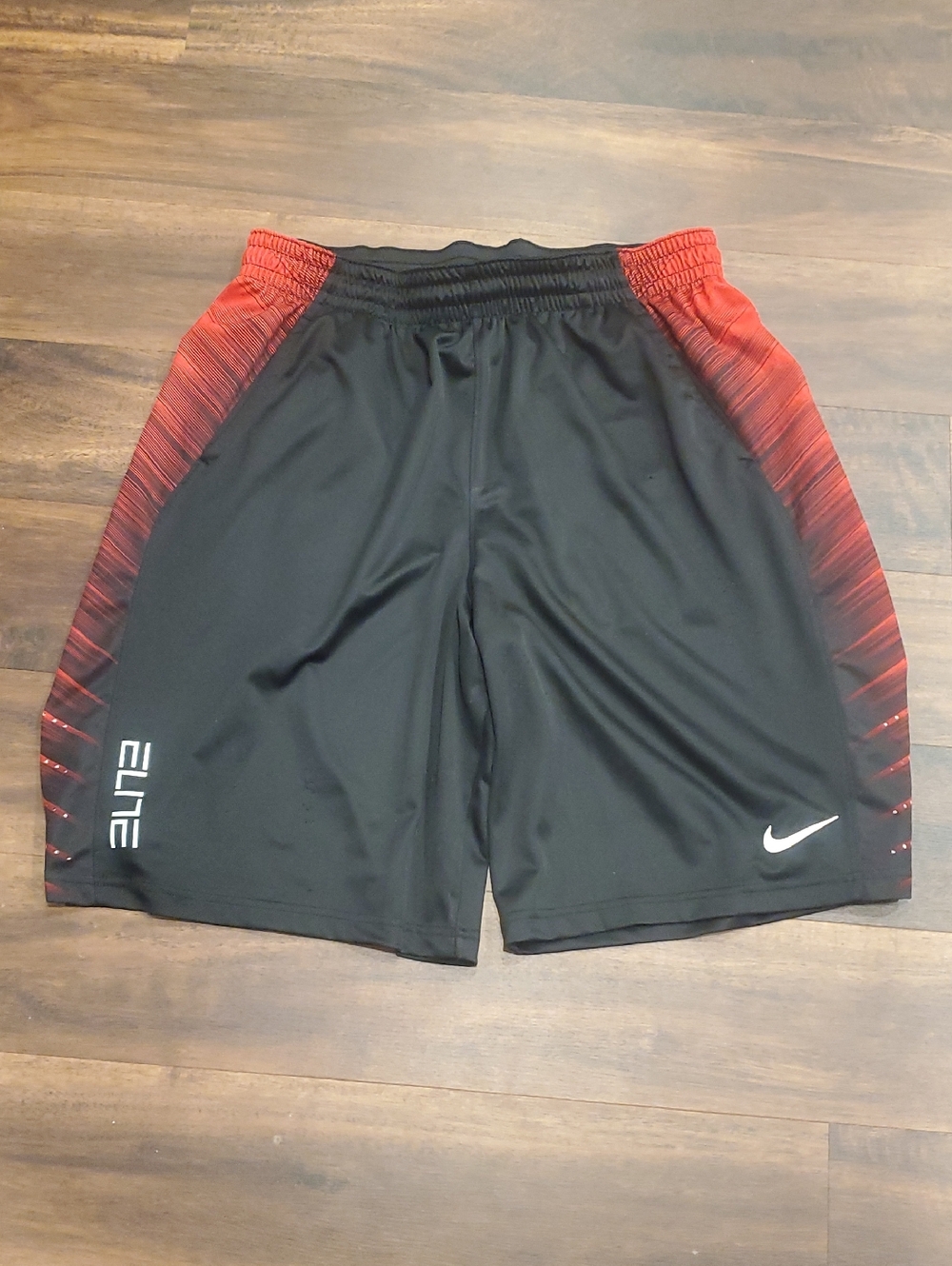 Nike Men's Black Shorts with Red Gradient Side Panels